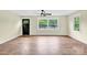 Bright living room featuring large windows and laminate floors perfect for entertaining at 1501 E Church St, Cherryville, NC 28021
