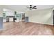 Open living room showcasing hardwood floors and recessed lighting leading to the modern kitchen at 1501 E Church St, Cherryville, NC 28021