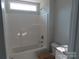 Bathroom featuring a shower and a toilet with granite countertop and white cabinets at 153 Mason Tanner Ct, Rock Hill, SC 29730