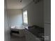 Bathroom features a tub, double vanity, and granite countertop at 153 Mason Tanner Ct, Rock Hill, SC 29730