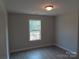 Cozy bedroom with hardwood floors and a large window that lets in plenty of natural light at 153 Mason Tanner Ct, Rock Hill, SC 29730