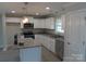 Modern kitchen featuring stainless steel appliances, granite countertops, and white cabinetry at 153 Mason Tanner Ct, Rock Hill, SC 29730
