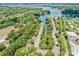 Aerial view showcasing waterfront community, lake access, and beautiful landscaping at 19901 Henderson Rd # M, Cornelius, NC 28031