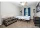 Bedroom with carpet, a queen bed, and natural light from a window at 19901 Henderson Rd # M, Cornelius, NC 28031