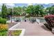 Community deck by the water perfect for gatherings with tables and chairs at 19901 Henderson Rd # M, Cornelius, NC 28031