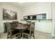 Cozy dining area with a round table and view into the kitchen at 19901 Henderson Rd # M, Cornelius, NC 28031