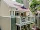 This exterior home view shows the design, including a patio and railings at 19901 Henderson Rd # M, Cornelius, NC 28031