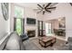 Bright living room featuring vaulted ceilings, fireplace, and dining area with natural light at 19901 Henderson Rd # M, Cornelius, NC 28031