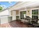 Relaxing covered patio with ceiling fan and sliding glass doors to the interior at 19901 Henderson Rd # M, Cornelius, NC 28031