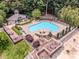 Aerial view showcasing pool, sundeck and cabana area with meticulously manicured landscaping at 19901 Henderson Rd # M, Cornelius, NC 28031