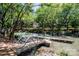 Scenic view of the lake from the dock, surrounded by lush greenery and waterfront condominiums at 19901 Henderson Rd # M, Cornelius, NC 28031
