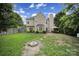 Large backyard with patio, fire pit, grass and fenced perimeter at 2017 White Cedar Ln, Waxhaw, NC 28173