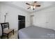 Comfortable bedroom featuring trey ceiling and closet storage at 2017 White Cedar Ln, Waxhaw, NC 28173