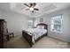 Cozy bedroom featuring trey ceiling and natural light from windows at 2017 White Cedar Ln, Waxhaw, NC 28173