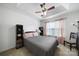 Cozy bedroom with trey ceiling and ceiling fan at 2017 White Cedar Ln, Waxhaw, NC 28173