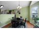Bright dining room with hardwood floors, chandelier, and views into the kitchen area at 2017 White Cedar Ln, Waxhaw, NC 28173