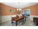 Bright dining room featuring a view into the living room and a classic chandelier at 2017 White Cedar Ln, Waxhaw, NC 28173