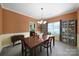 Bright dining room with a chandelier, wainscoting, and a view into the adjacent kitchen at 2017 White Cedar Ln, Waxhaw, NC 28173