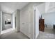 Hallway with closet, overhead lighting and neutral color scheme at 2017 White Cedar Ln, Waxhaw, NC 28173