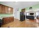 Spacious kitchen with modern appliances, dark cabinetry, and an open layout into the living area at 2017 White Cedar Ln, Waxhaw, NC 28173
