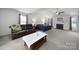 Large main bedroom featuring sitting area, fireplace, ceiling fan and natural light at 2017 White Cedar Ln, Waxhaw, NC 28173