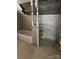 This bathroom features a tub with tiled walls and a storage shelf beside it at 208 E Main St, Cleveland, NC 27013