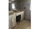 This bathroom features a double sink vanity with white cabinets and an unusual built-in appliance at 208 E Main St, Cleveland, NC 27013