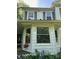 Home exterior featuring a mix of window styles and siding, capturing natural light at 208 E Main St, Cleveland, NC 27013
