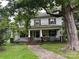 Charming two-story home with a large front porch and lush landscaping at 208 E Main St, Cleveland, NC 27013