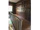 This hallway features wooden floors and shelving with a view to the lower level at 208 E Main St, Cleveland, NC 27013