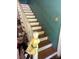 This staircase features wooden steps with a white handrail leading to the upper level at 208 E Main St, Cleveland, NC 27013