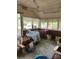 Enclosed sunroom with large windows providing natural light, offering a versatile space at 208 E Main St, Cleveland, NC 27013
