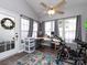 Bright bonus room with ceiling fan, hardwood floors, a bike, and plenty of natural light at 2147 Lake Breeze Ln, Denver, NC 28037