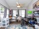 Bright bonus room with ceiling fan, hardwood floors, a bike, and plenty of storage at 2147 Lake Breeze Ln, Denver, NC 28037