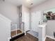 Welcoming entryway with stylish decor, practical baby gate, and convenient storage at 2147 Lake Breeze Ln, Denver, NC 28037