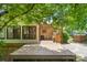Inviting back patio featuring a wooden deck, brick facade, and lovely outdoor space at 232 Scottridge Dr, Charlotte, NC 28217