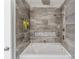 Gorgeous bathroom features tiled shower with dual shower heads and a soaking tub at 232 Scottridge Dr, Charlotte, NC 28217