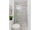 Contemporary bathroom features tiled shower with sliding glass doors, rainfall shower head and storage niches at 232 Scottridge Dr, Charlotte, NC 28217