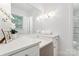 Bright bathroom vanity with granite counters, decorative orchid, and large mirror perfect for morning preparation at 232 Scottridge Dr, Charlotte, NC 28217