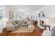 Open-concept living room featuring hardwood floors, fireplace, and ample natural light at 232 Scottridge Dr, Charlotte, NC 28217