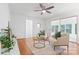 Inviting living room with hardwood floors, a ceiling fan, and modern furnishings at 232 Scottridge Dr, Charlotte, NC 28217