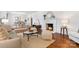 Bright and airy living room with hardwood floors, fireplace, and seamless flow to the dining area at 232 Scottridge Dr, Charlotte, NC 28217