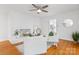 Charming living room with a white brick fireplace, hardwood floors, and comfortable seating at 232 Scottridge Dr, Charlotte, NC 28217