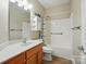 Bathroom featuring a vanity, sink, toilet, tub and shower combo, and storage at 2323 Granville Pl # A, Monroe, NC 28110