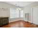 Sunlit dining room featuring hardwood floors, large windows and stylish chandelier at 2323 Granville Pl # A, Monroe, NC 28110