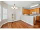 Open dining room with hardwood floors connects to the kitchen area at 2323 Granville Pl # A, Monroe, NC 28110