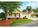 Inviting yellow home with manicured landscaping and an attached two car garage at 2323 Granville Pl # A, Monroe, NC 28110