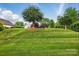 A lush green lawn enhances the curb appeal of this delightful property at 2323 Granville Pl # A, Monroe, NC 28110