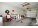 Spacious garage providing ample storage with shelving units and an access point to the attic at 2323 Granville Pl # A, Monroe, NC 28110