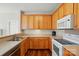 Well-lit kitchen featuring wood cabinets and laminate countertops at 2323 Granville Pl # A, Monroe, NC 28110